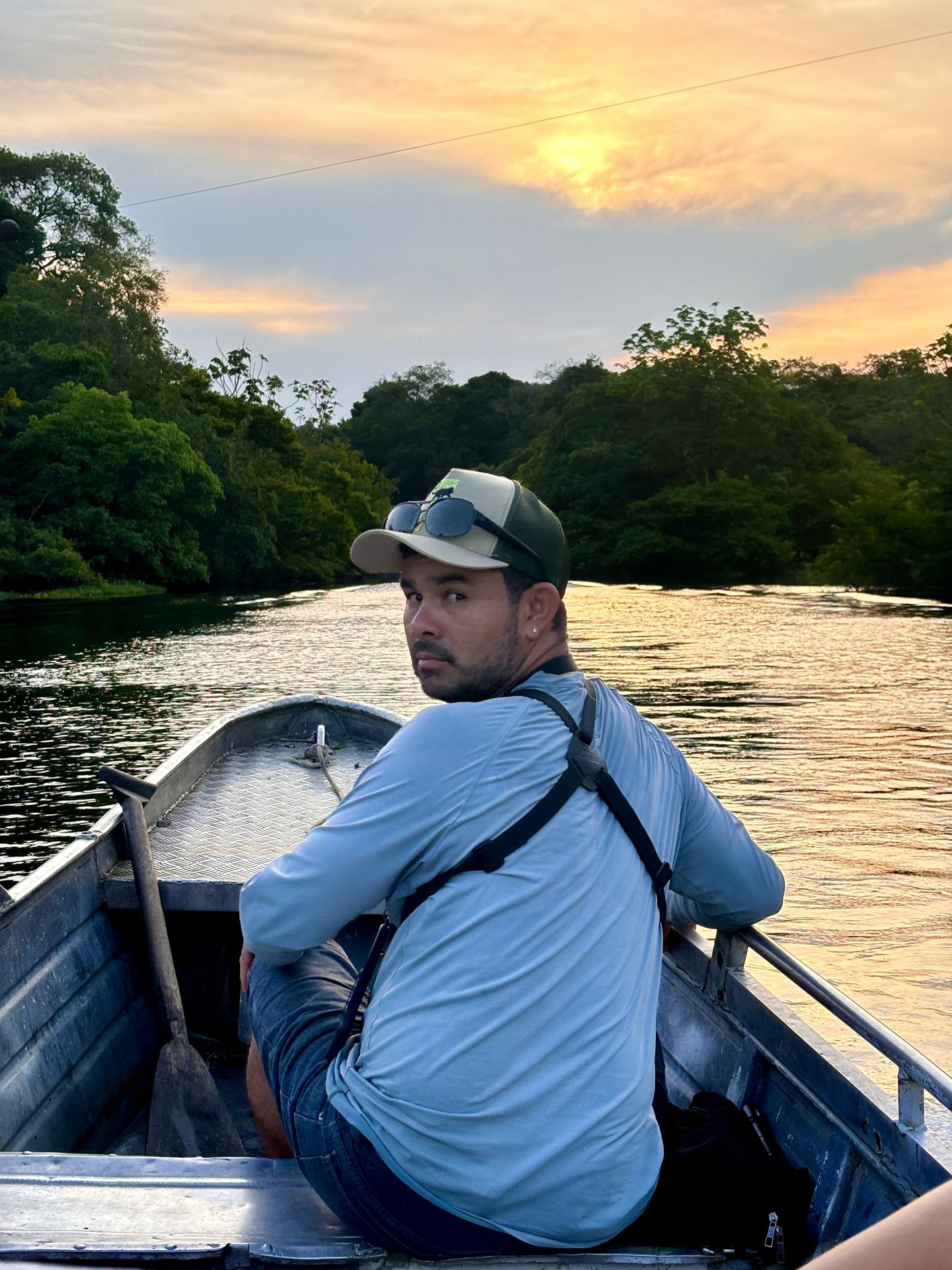 Amazon Eco Travellers naturalist guide on the Rio Negro at golden hour