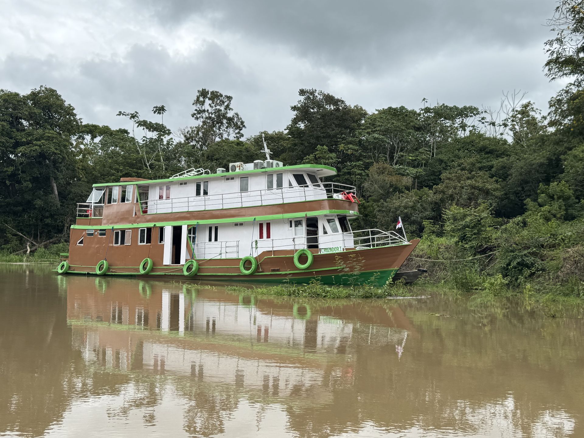 Amazon riverboat anchored in a jungle river â€” Rio Negro